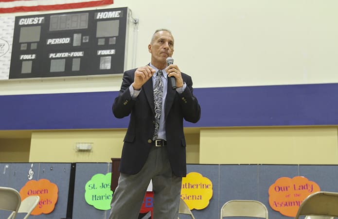 Mayor Derek Easterling of Kennesaw gives a motivational charge to the students before they set off for competition during the 16th annual Battle of the Books at St. Catherine of Siena School, Kennesaw. Photo By Michael Alexander