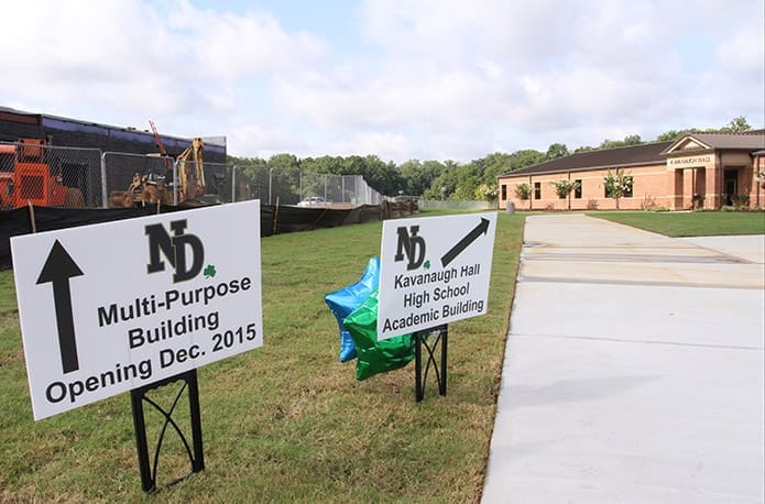 As one arrives on campus, signs offer direction to the current high school building and the building under construction that will serve the high school a few months from now. Photo By Michael Alexander