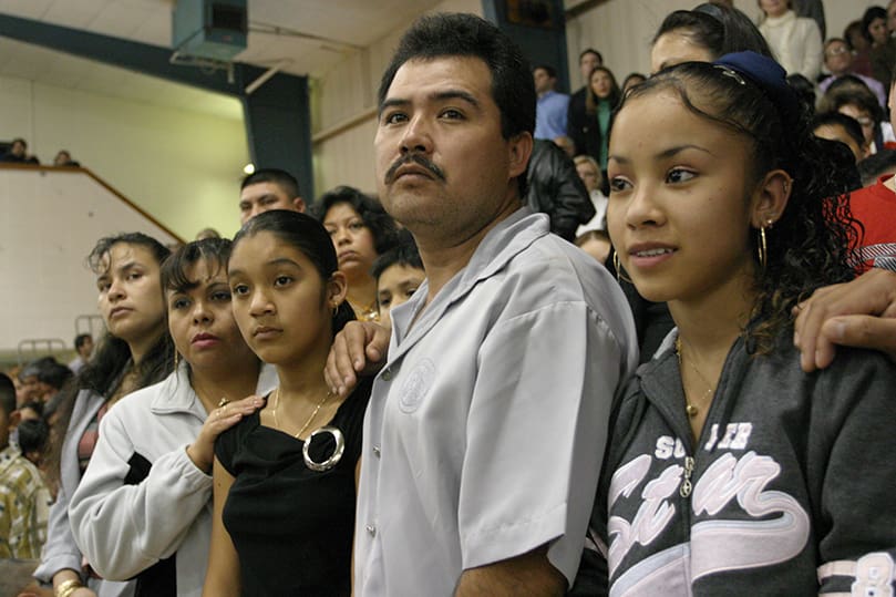 Angela Toledo, second from left, stands with her 12-year-old daughter Karina Gonzalez, a catechumen at Our Lady of the Americas Mission, Doraville. Gonzalez is also joined by her father Jose Luiz. At the far right is another catechumen Nellie Morales, also from the mission. Photo by Michael Alexander