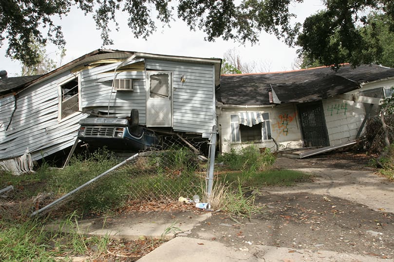 While some homes have been demolished in New Orleans' Lower 9th Ward, nearly a year later others remain topsy-turvy by the force of the water.