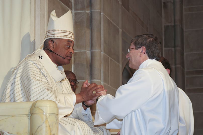 Deacon candidate John Peterson promises his obedience to Archbishop Gregory and his successors during his ordination to the permanent diaconate at the Cathedral of Christ the King, Atlanta. Photo By Michael Alexander