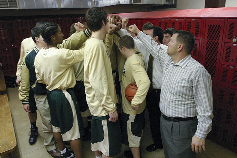 The Blessed Trinity Titans are minutes away from taking the court as they break the huddle at Druids Hills’ gymnasium on Jan. 29, a place where Blessed Trinity is winless. They had to use three different zone defenses to keep a quick, 3-point shooting Druid Hills team off balance. It also took clutch free throw shooting from senior forward Ryan Aquino with 7.8 seconds left in the game to seal a 52-48 victory, and the team’s 21st consecutive win. Photo By Michael Alexander