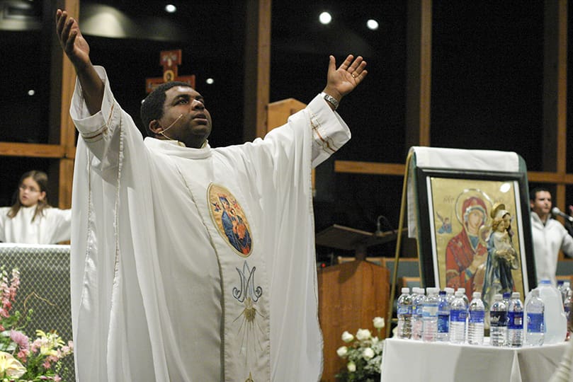 Father Roger Araujo is the main celebrant for the 8 p.m. Mass at Holy Family Church, Marietta. He heads up the Brazilian ministry at St. Jude the Apostle Church too. Photo By Michael Alexander