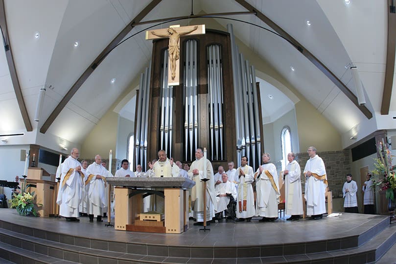 Archbishop Wilton D. Gregory, the principal celebrant and homilist for the Mass of Dedication, is joined on the altar during the Liturgy of the Eucharist by his brother priests. Photo By Michael Alexander