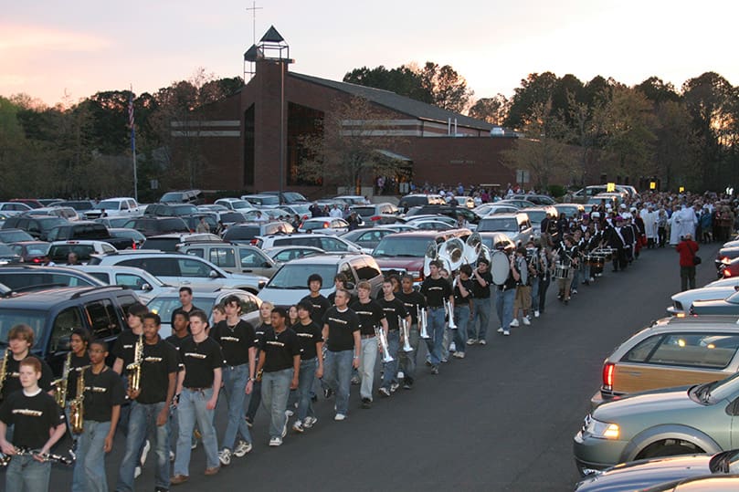 Fifty members of the Sprayberry High School Marching Band, Marietta, lead a procession from Transfiguration Church to the new parish Family Life Center. Photo By Michael Alexander