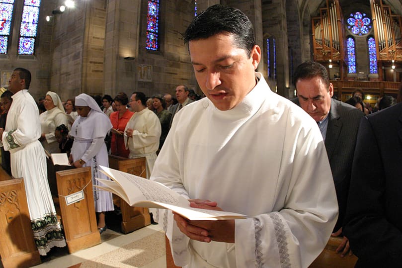 Ordination candidate Mario Lopez-Castro joins the congregation in singing the 