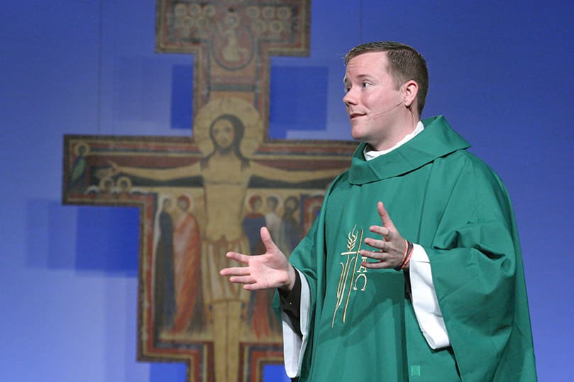 Father Nick Schumm, parochial vicar at St. Rose of Lima Church, Milton, Fla., delivers his homily during the morning Mass of the Steubenville Atlanta Conference, July 18. Photo By Michael Alexander