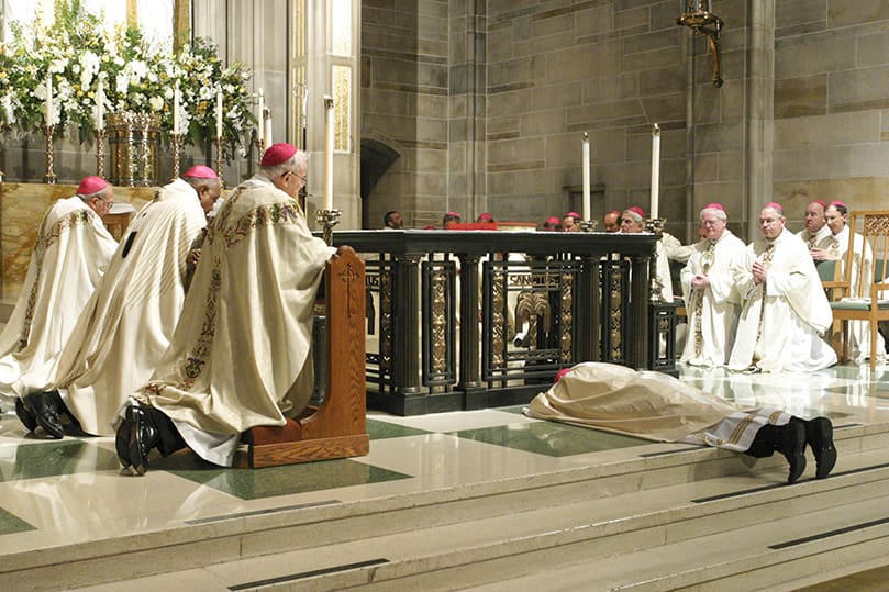 Bishop Luis Zarama lays prostrate before the altar as all in attendance pray for his ordination and the entire Church.