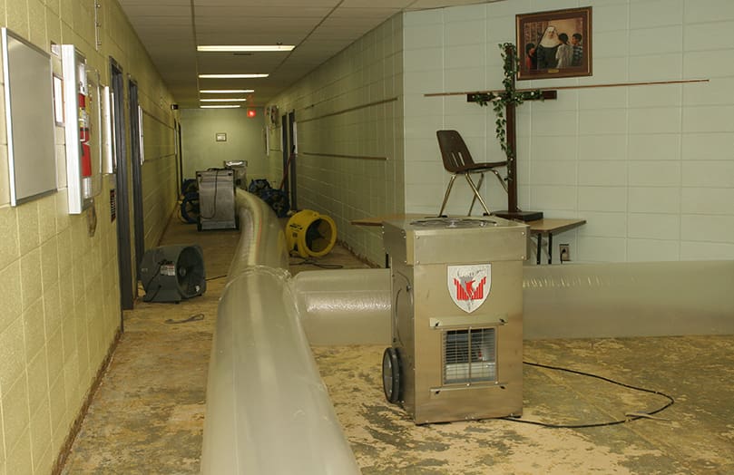 The lower level of St. John Neumann Regional School took in six inches of water. Once the wet carpet was stripped from the floors, six industrial strength dehumidifiers and 20 industrial fans were brought in to dry the area.