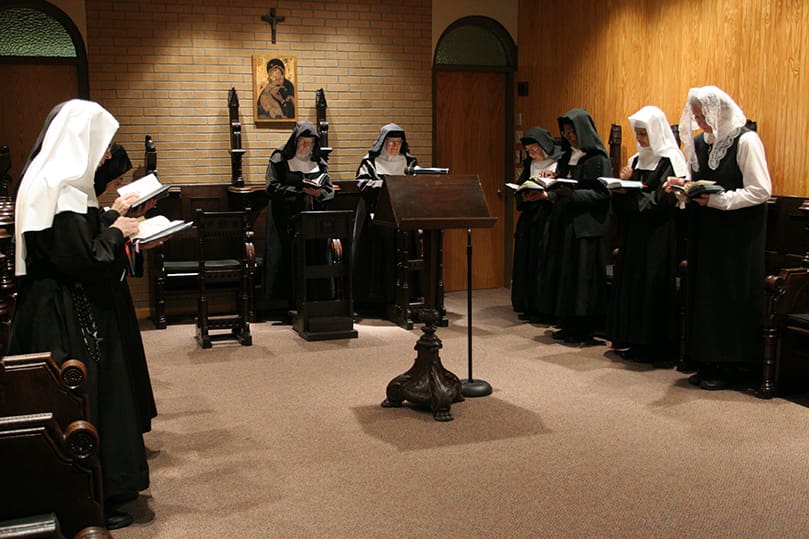 The Sisters of the Visitation, Snellville, participate in the Divine Office of morning prayer. The sisters pray the Divine Office five times a day. Photo By Michael Alexander