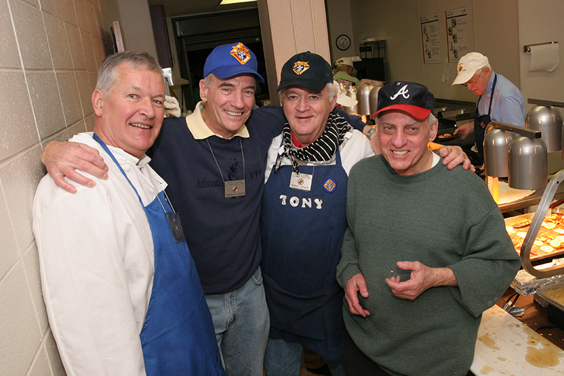 Fish fry workers (l-r) Stan Wasowski, Tom Simon, Tony Joyce and Ray Gustine take a brief break during the final 48 minutes of the fish fry. Photo By Michael Alexander