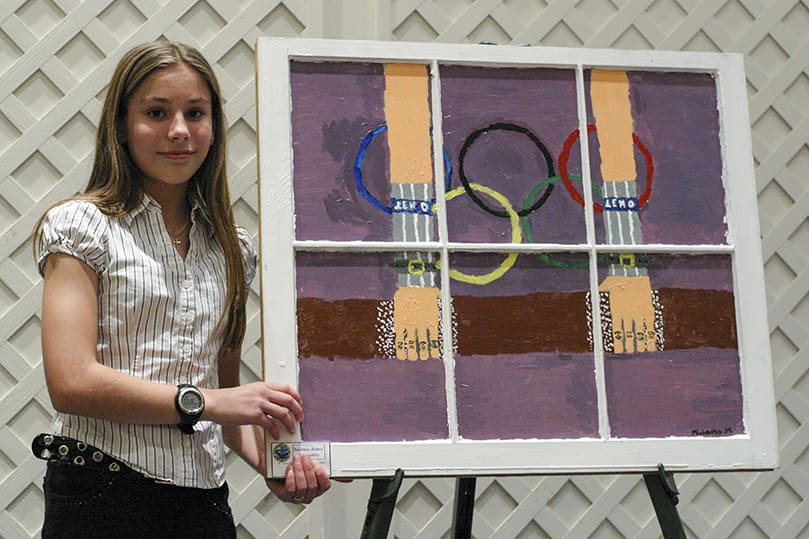 Michaela Murphy, 13, stands by her painting of an Olympic gymnast. Murphy said, 