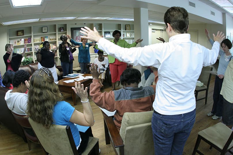 IgIgnatian Spirituality Project of Atlanta facilitators and retreatants pray with and pray for one another as the day and half retreat for homeless women and women in recovery at the Ignatius House Retreat Center comes to an end, April 21. Photo By Michael Alexander
