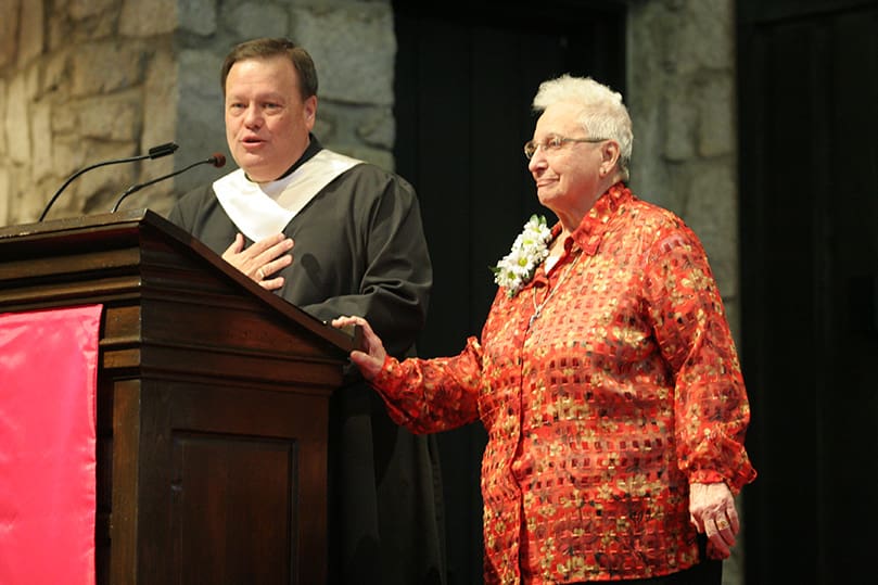 St. Jude the Apostle Church music director Alan Brown, left, shares how Sister Eileen Murray sang "His Eye Is On The Sparrow" during an audience with Pope John Paul II when the parish choir traveled to Rome in 1990. She also performed a solo of the song during the Dec. 13 farewell Mass, which honored the last two remaining Grey Nuns of the Sacred Heart in the Archdiocese of Atlanta. Photo By Michael Alexander