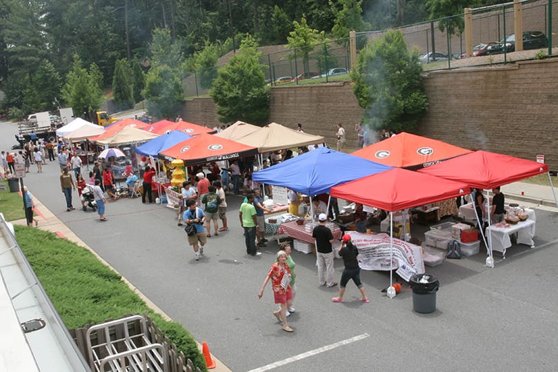 Festival goers stop by the various food and retail vendors during the Indonesian Festival at Our Lady of the Assumption Church, Atlanta, marking the community's 10th anniversary at the parish. Photo By Michael Alexander