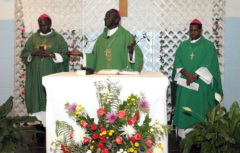 Bishop Rudolf Deng Majak, center, was the main celebrant for the June 27 Mass celebrated with the Sudanese community at Corpus Christi Church, Stone Mountain. Concelebrating with him are Auxiliary Bishop Daniel Adwok Kur , left, and Bishop Eduardo Hiiboro Kussala. Bishop Rudolf Deng Majak, center, was the main celebrant for the June 27 Mass celebrated with the Sudanese community at Corpus Christi Church, Stone Mountain. Concelebrating with him are Auxiliary Bishop Daniel Adwok Kur , left, and Bishop Eduardo Hiiboro Kussala. Photo By Michael Alexander