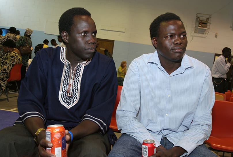 Duang Deng, left, of Birmingham, Ala., and Lino Diadi Momo of Atlanta were part of the choir that provided the music during the June 27 Mass. The pair of 31-year-olds came to the United States in 2000 and 2003. Bishop Rudolf Deng Majak, center, was the main celebrant for the June 27 Mass celebrated with the Sudanese community at Corpus Christi Church, Stone Mountain. Concelebrating with him are Auxiliary Bishop Daniel Adwok Kur , left, and Bishop Eduardo Hiiboro Kussala. Photo By Michael Alexander