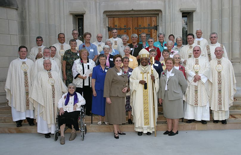 Prior to the Sept. 1 Mass, Grey Nuns of the Sacred Heart in attendance gather on the Cathedral of Christ the King steps with Archbishop Gregory and the priests who concelebrated the liturgy with him. Photo By Michael Alexander