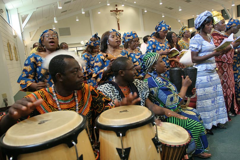 Members of the Cameroon Catholic Community choir sing during the Mass on the Feast of the Assumption of the Blessed Virgin Mary. Photo By Michael Alexander