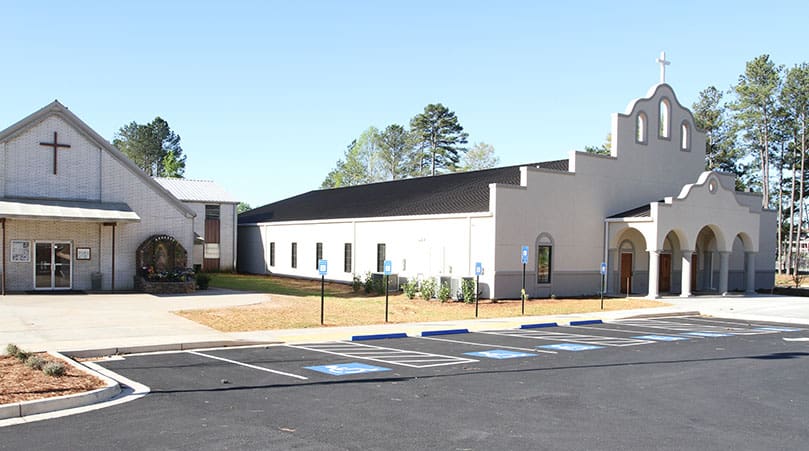 The old San Felipe de Jesus Mission, Forest Park, sits to the left of the new 11,200-square-foot church, which also doubled the congregation’s seating capacity to 600. Photo By Michael Alexander