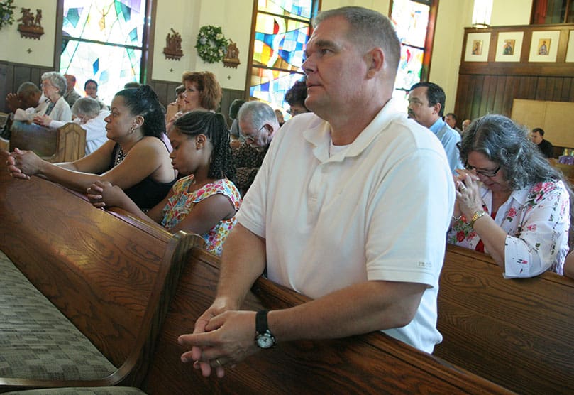 Mike Knippel, retired military, attends the final daily Mass at the Cantonment Chapel, June 7. Photo By Michael Alexander