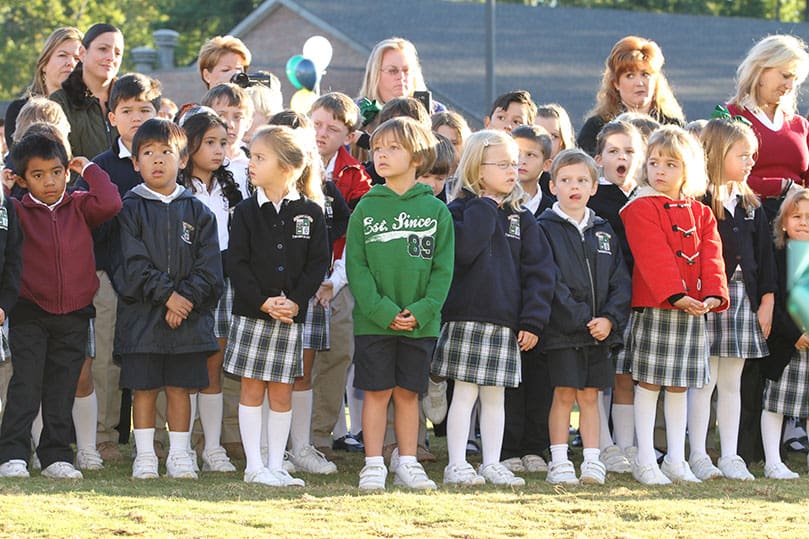 Lower School students, like the kindergartners pictured here, will be the beneficiaries of the new Activities Building, which includes a gym, a stage, coaches’ offices and restrooms. Families, students, faculty, staff and Pinecrest Academy board of directors gathered on the grounds of the new John Paul II Lower School Activities Building for its Oct. 4 dedication. Photo By Michael Alexander