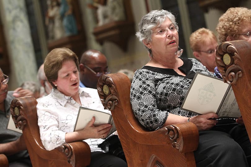Members of St. Philip Benizi Church, Jonesboro, like Yone Daly, left, and Gerry Henley travelled to Savannah for the solemn vespers, as well as the episcopal ordination of Bishop-elect Gregory Hartmayer, who served as their parish pastor for 15 years. Photo By Michael Alexander  