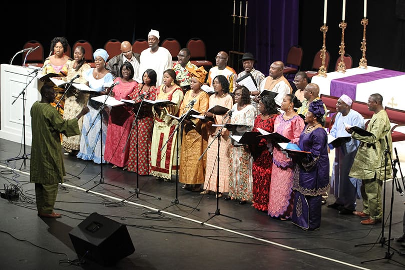 The Gambian Christian Organization of Atlanta Choir, based out of Immaculate Heart of Mary Church, Atlanta, sings for the crowd prior to the Rite of Election and Call to Continuing Conversion at the Atlanta Civic Center, Feb. 26. Photo By Michael Alexander