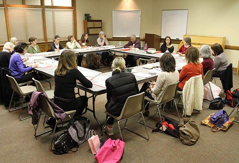 Seventeen facilitators of the Women's Bible Study group meet to discuss an upcoming lesson. The group, which meets each Monday at 9:30 a.m., was started in 1997.