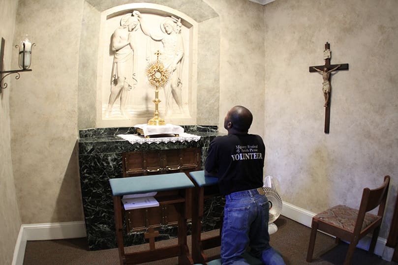 A man prays before the Blessed Sacrament in the perpetual adoration chapel at the Cathedral of Christ the King, Atlanta. At the request of the late Archbishop John F. Donoghue, it was the first adoration chapel to open in 1994.