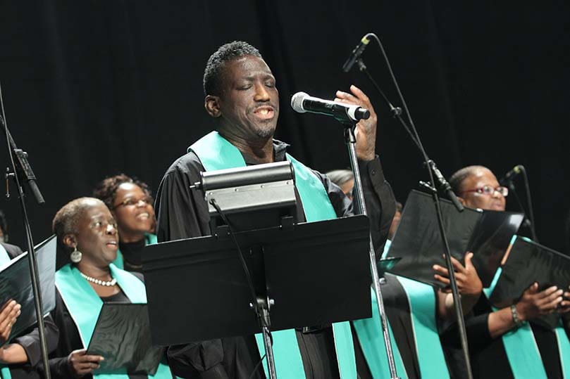 Soloist E. Walter Smith joins the choir in singing the hymn of thanksgiving, 