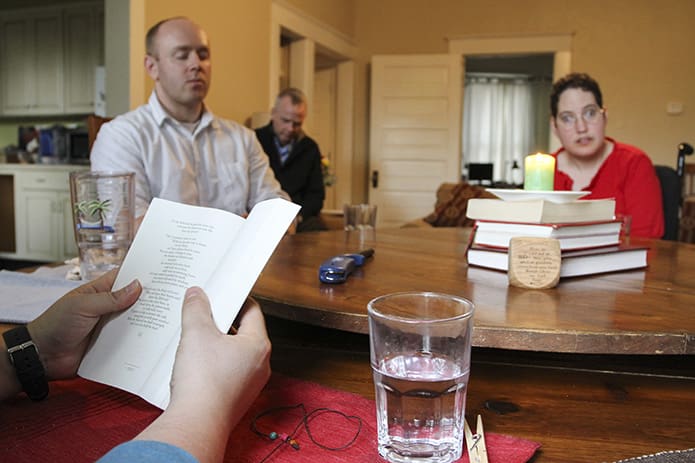 After the evening meal, the group moves into prayer time. There is usually a reading from ure and an opportunity for house residents to share what is on their hearts. Photo By Michael Alexander