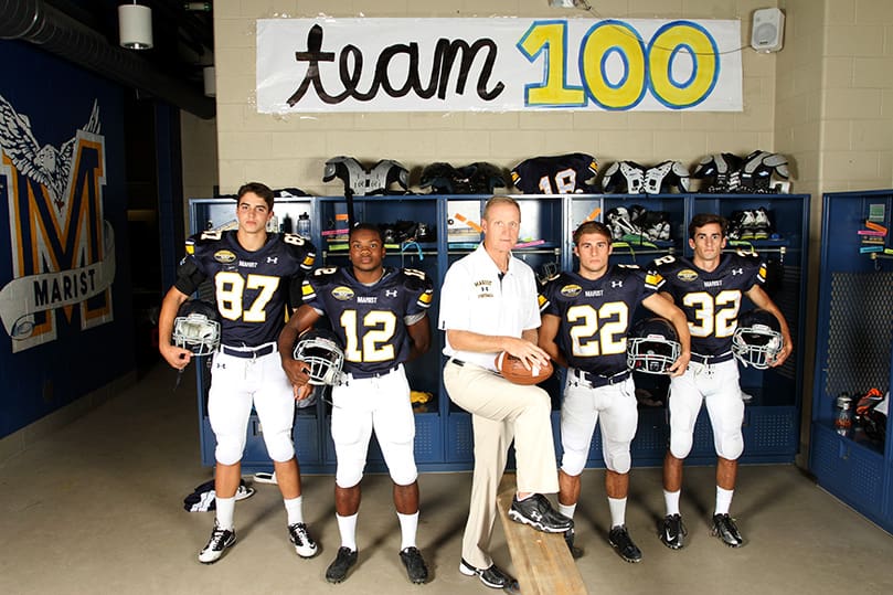 Alan Chadwick, center, the head varsity football coach at Marist School, Atlanta, is joined by four seniors from the 2012 team. They include (l-r) tight end and defensive end Greg Taboada, quarterback and defensive back Myles Willis, running back and defensive back Gray King and free safety Brandon Young. Chadwick reached and surpassed his 300th career victory mark earlier this season. Photo By Michael Alexander