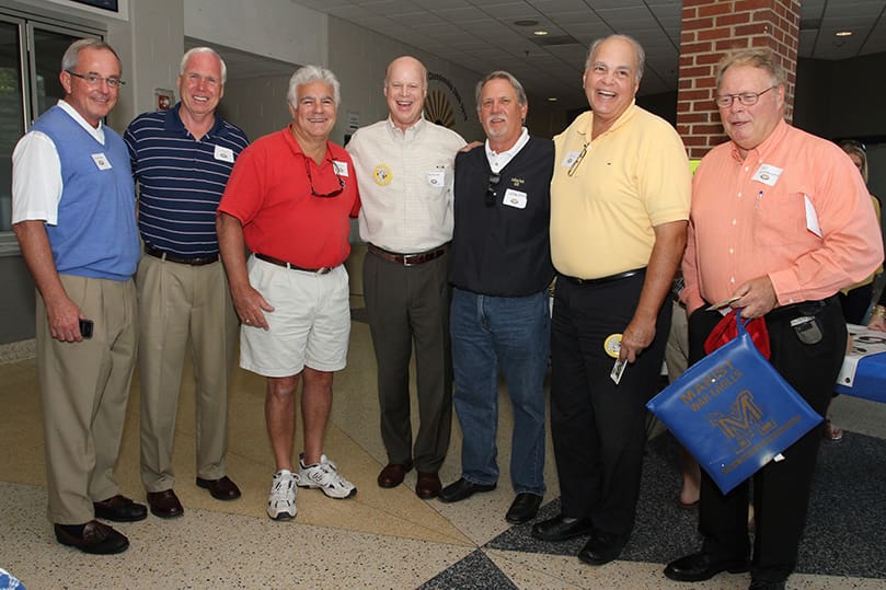 Marist football alum including (l-r) Frank McCloskey (guard, class of ’68), Joe Neiner (tight end/defensive end, class of ‘68), Richard Difore (split end/defensive end, class of ‘68), Clarence Smith (tight end/defensive end, class of ’68), Larry Sertich (fullback/safety, class of ’68), Jim “Butch” Murphy (lineman, class of ’66), and Lou Lombardy (fullback, class of ’65) return to the school for the special celebration and game marking the 100th anniversary of the Marist football program. Photo By Michael Alexander