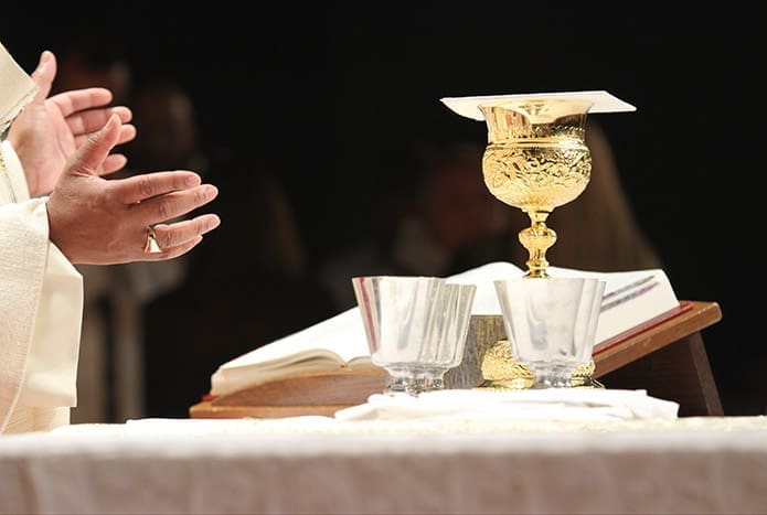 During the Eucharistic Congress vigil Mass, Archbishop Wilton D. Gregory conducts the liturgical prayers before the body and blood of Christ after the consecration. Photo By Michael Alexander