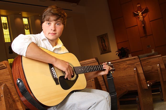 Pinecrest Academy senior Evan Montalbano is a self-taught guitarist. At the age of 14 he encountered personal tragedy when his mother died unexpectedly. With the support of his grandparents, godfather and the school community, Montalbano persevered in his time of grief, and he will attend the University of Georgia, Athens. Photo By Michael Alexander