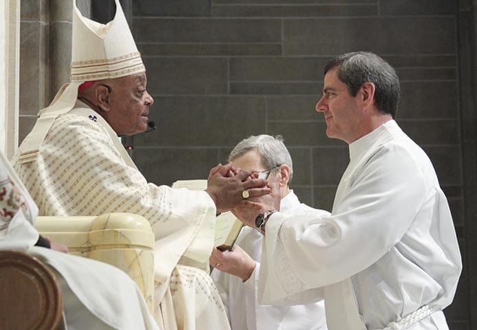 Michael Chavez of St. Oliver Plunkett Church, Snellville, pledges his obedience to Archbishop Wilton D. Gregory and his successors. Photo By Michael Alexander