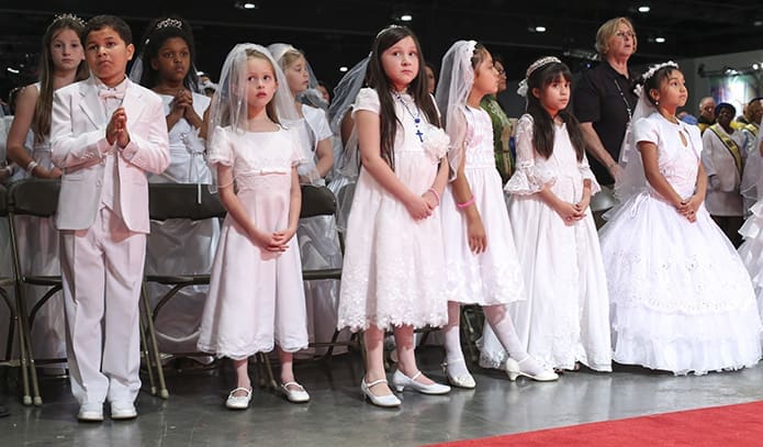 First communicants from various parishes around the Archdiocese of Atlanta attend the closing Mass of the June 6 Eucharistic Congress. Photo By Michael Alexander