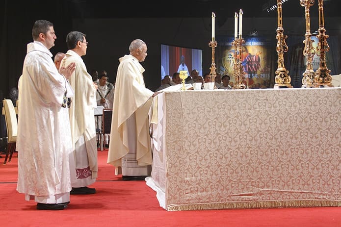 Archbishop Wilton D. Gregory, center, the main celebrant and homilist, leads the congregation through the Liturgy of the Eucharist during the closing Mass of the 20th annual Eucharistic Congress. Photo By Michael Alexander