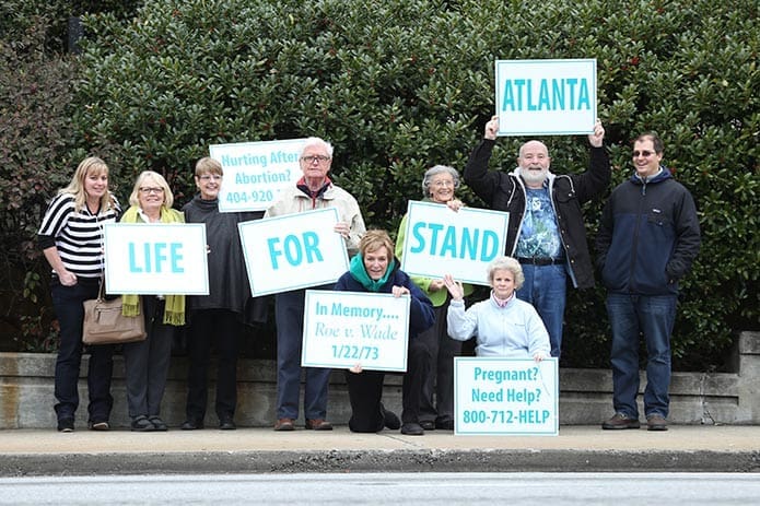 Members of Our Lady of the Assumption Church in Atlanta stand along Peachtree Road during the Jan. 22 Stand For Life. Photo By Michael Alexander