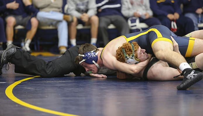 In the 195-pound division Marist School senior Robert Larmore pins Blessed Trinity High School freshman John Jacobs in the match’s first period. With the victory Larmore reached 84 wins and 38 pins. Photo By Michael Alexander