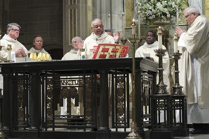 Archbishop Wilton D. Gregory, center, is joined at the Cathedral of Christ the King altar with his brother clergy during the Liturgy of the Eucharist at the Jan. 22 Mass for the Unborn. Photo By Michael Alexander