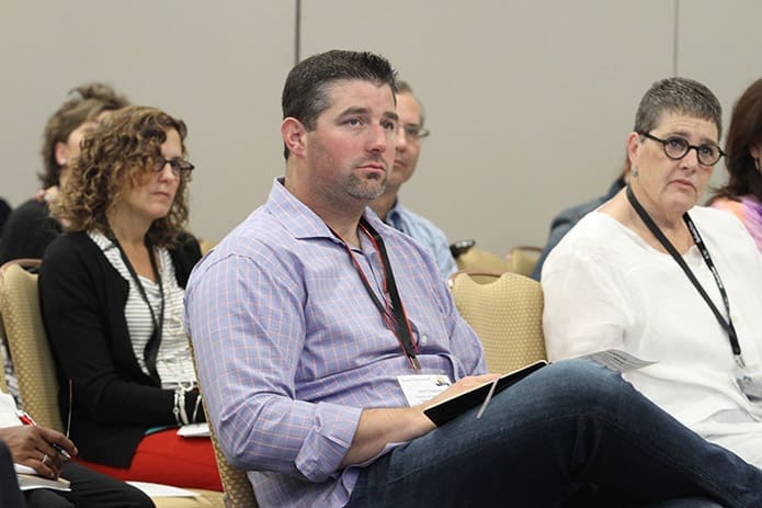 Jason Caywood, center, of St. Vincent de Paul Church, Salt Lake City, Utah, listens during one of the morning workshops on day three of the International Catholic Stewardship Council’s annual conference at the Hyatt Regency Hotel, Atlanta. Photo By Michael Alexander