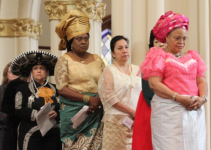Women and men of different cultures from around the archdiocese gather to pray the intercessory prayers in their native language. Photo By Michael Alexander
