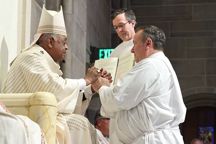 Gregory Orf of Good Samaritan Church, Ellijay, pledges his obedience to Archbishop Wilton D. Gregory and his successors during the Feb. 4 rite of ordination to the permanent diaconate at the Cathedral of Christ the King, Atlanta. Photo By Michael Alexander