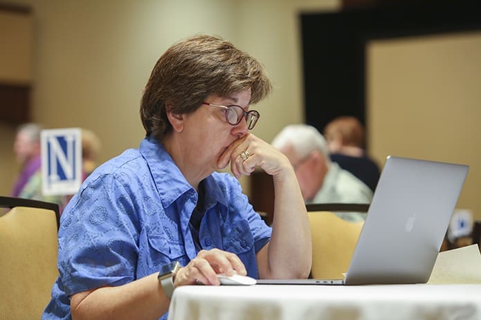 Sister of St. Joseph Sandy DeMasi, director of worship at St. Rose of Lima Church, Short Hills, N.J., works at her computer between plenary sessions on study day during the National Meeting of Diocesan Liturgical Commissions at the Atlanta Omni Hotel. Photo By Michael Alexander