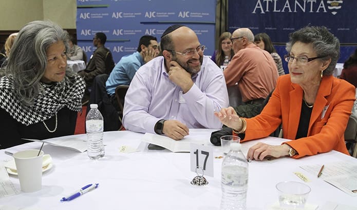 While the evening was comprised primarily of dialogue between Catholics and Jews like Yisrael Frenkel, center, a member of Young Israel of Toco Hills, and Barbara Schneider, right, a member of Temple Sinai, Sandy Springs, Rev. Karen Webster Parks, associate pastor at Cascade United Methodist Church, Atlanta, also participated in the discussion. Photo By Michael Alexander
