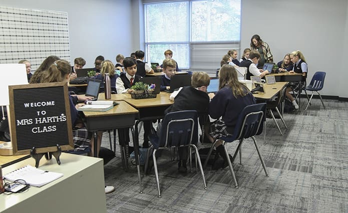 Sixth-grade students sit in Kerry Harthâs new middle school classroom. Harth is the middle school coordinator at Our Lady of the Assumption School, Atlanta. Photo By Michael Alexander