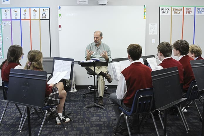 Music and band teacher, Mike Gibson, center, conducts class in the new music room. The middle school and pre-kindergarten students moved into the new wing of the school Nov. 26. Photo By Michael Alexander