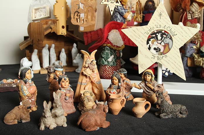 The Native American crèche in the foreground was purchased in Helen, Ga. It is one of the 500 nativities, from the personal collection of St. Pius X Church parishioner, Marcy Borkowski-Glass, on display during the Christmas Crèche Exhibit at the Monastery of the Holy Spirit in Conyers. The exhibition runs through Dec. 24. Photo By Michael Alexander